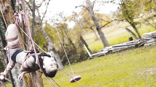 Outdoor Bondage Shibari Suspension - Tattoo Skinny Girl in Ropes on a Tree