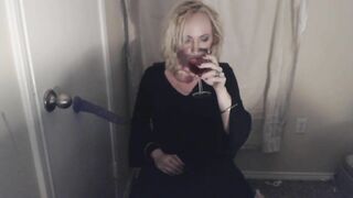 Goth Tranny smokes and pleasures herself.