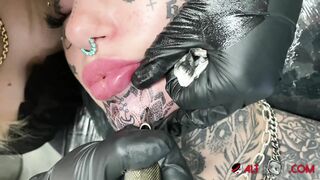 Australian Bombshell Amber Luke Gets a new Chin Tattoo