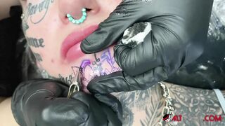 Australian Bombshell Amber Luke Gets a new Chin Tattoo