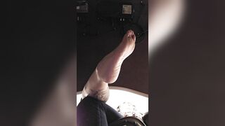 Bored Goth Girl Ignores you under her Desk Dangling Feet and Flipping you off