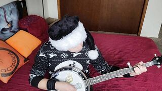 Transgirl Anally Masturbates while Playing Banjo
